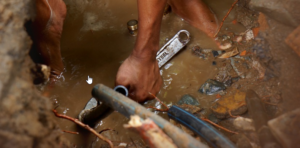 plumber fixing water pipes