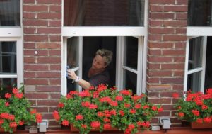 man cleaning window